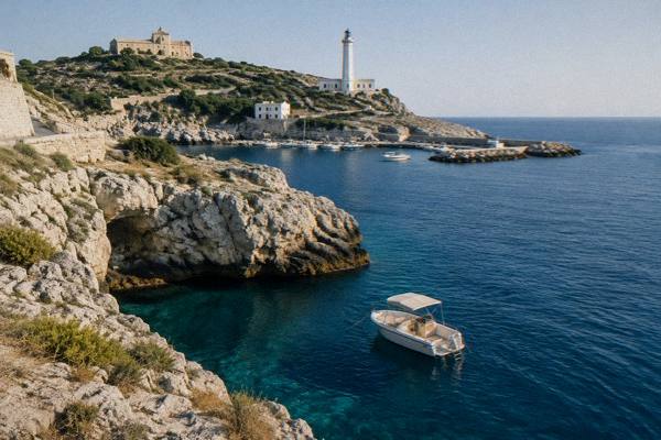 A small boat anchored in clear deep-blue water beside a sea cliff, a ladder at the stern for swimmers, Santa Maria di Leuca, Puglia
