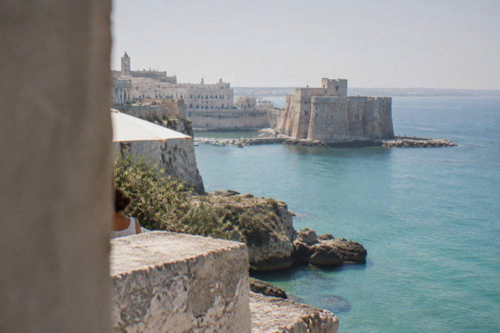 Turquoise water and limestone cliffs on the Salento coast near Otranto