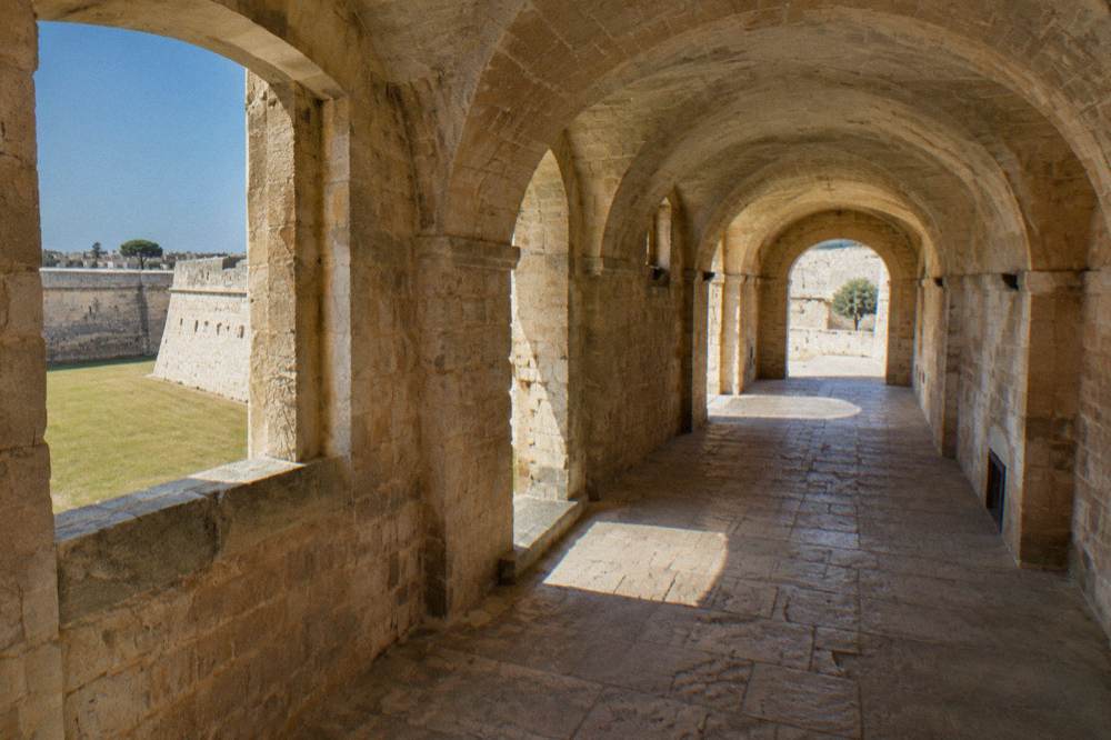 A vaulted stone passage inside the Castello Carlo V fortress in Lecce