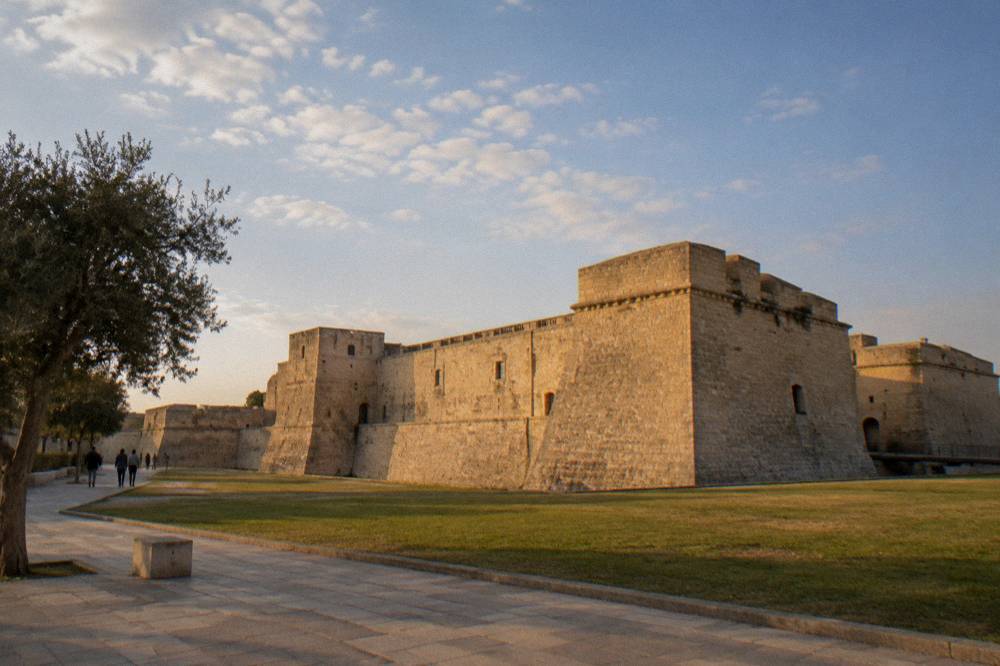The castle fortress walls seen from the redesigned piazza in Lecce at golden hour