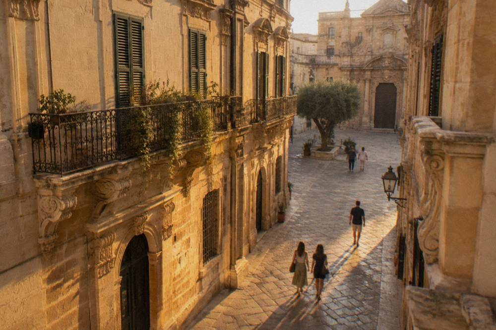 Sunlit Lecce street with baroque facades near the museum quarter
