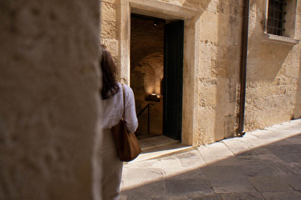 Narrow stone doorway into a historic townhouse