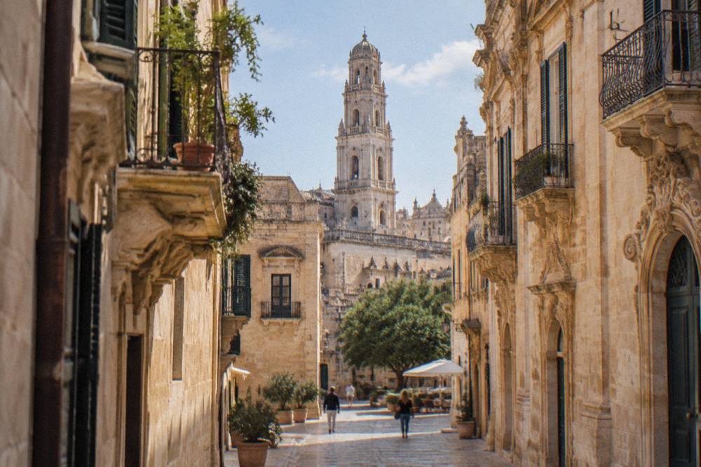 The bell tower of Lecce Cathedral rising above the rooftops of the old town