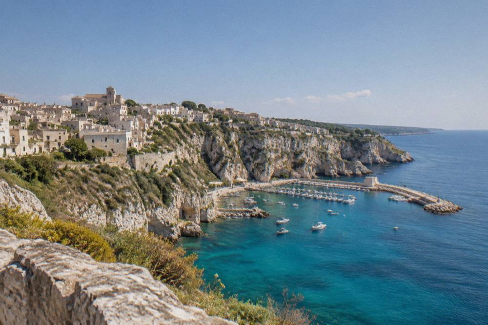 White limestone cliffs dropping into turquoise water on the Adriatic coast near Castro