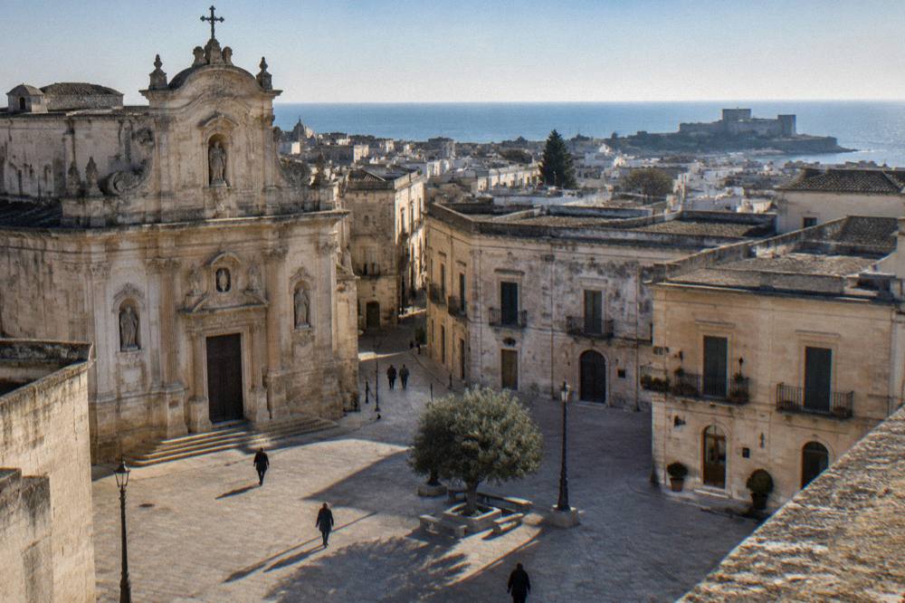 Coastal town skyline with a castle and sea horizon in southern Puglia