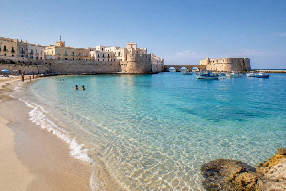 A wide Ionian beach with pale sand and clear shallow water south of Gallipoli