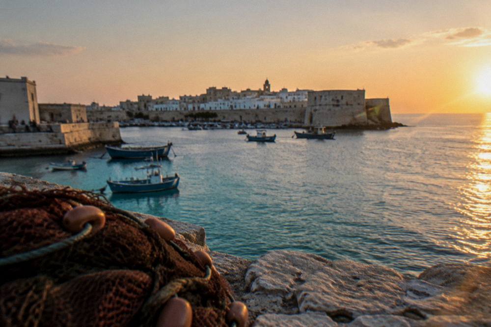 Sunset over the Ionian sea from Gallipoli's sea walls with the island skyline