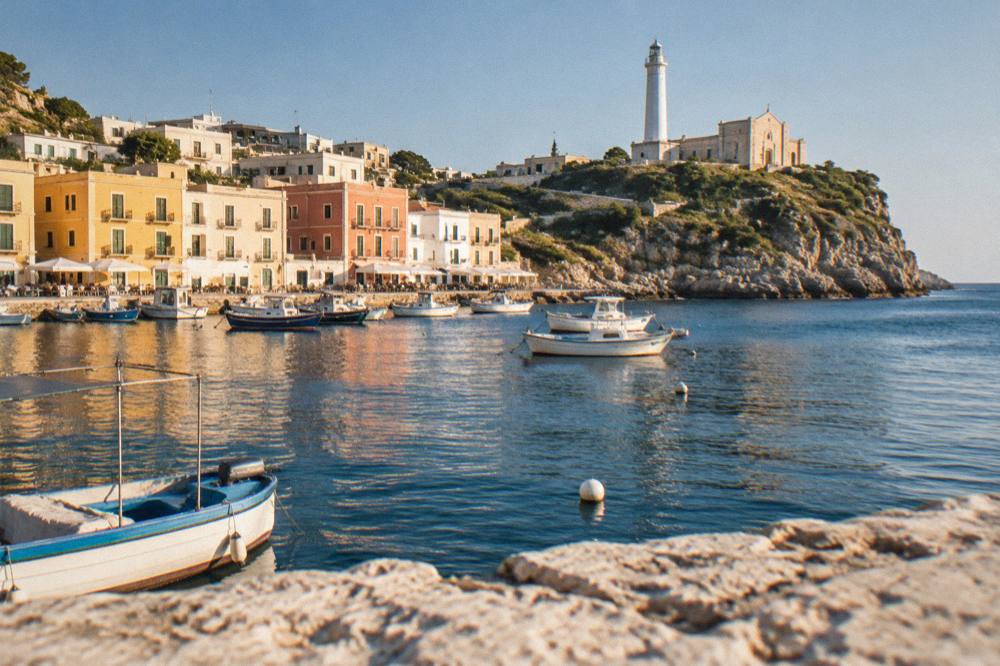 Small boats moored in a harbour below colourful buildings on a summer evening
