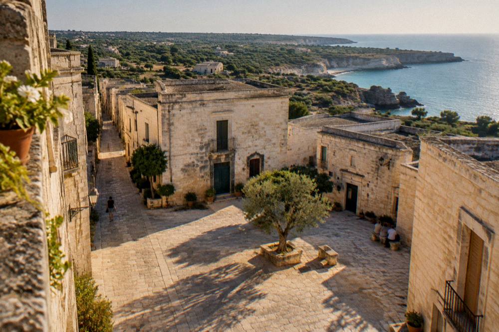 Turquoise water and limestone cliffs on the Salento coast at sunset