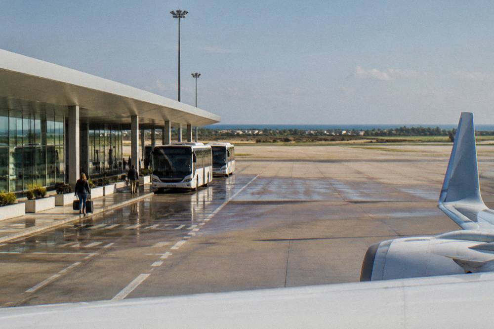 A long-distance coach parked at a station bay in an Italian city