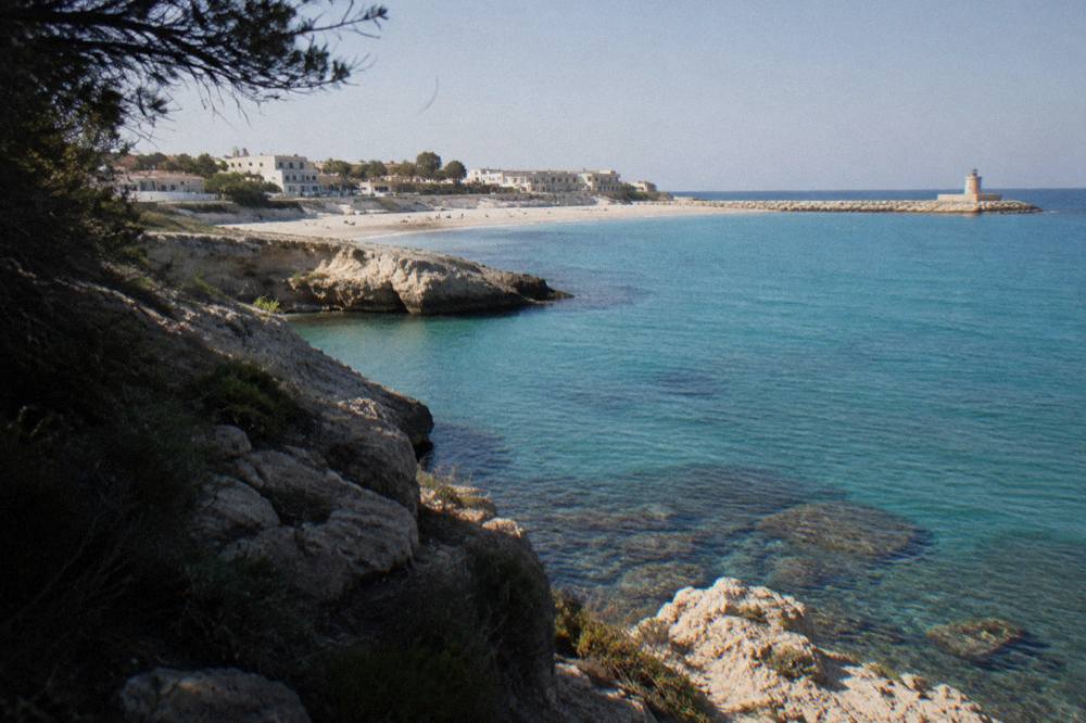 A rocky Adriatic cove with turquoise water below low cliffs in Salento