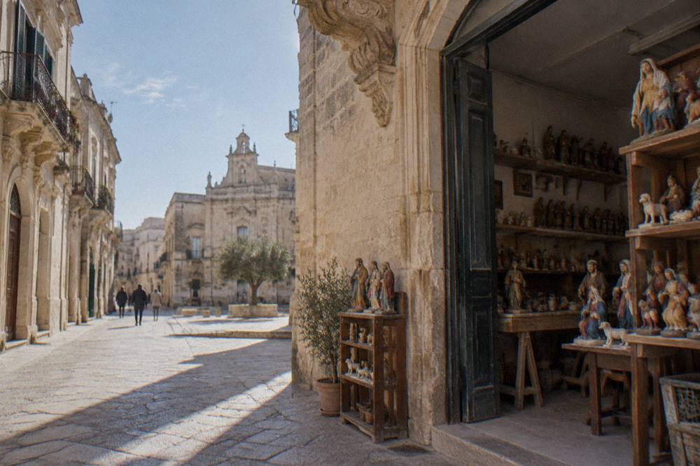 A papier-mache artisan workshop in Lecce with painted nativity figures on shelves