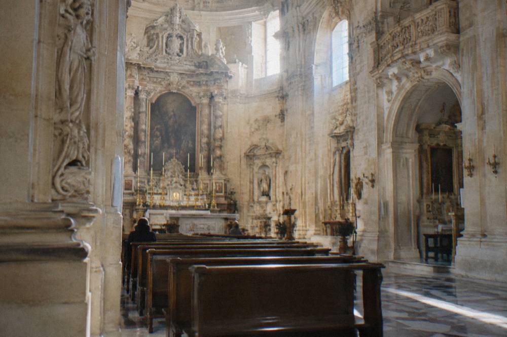 Interior of a Lecce church with baroque altar and winter light through windows