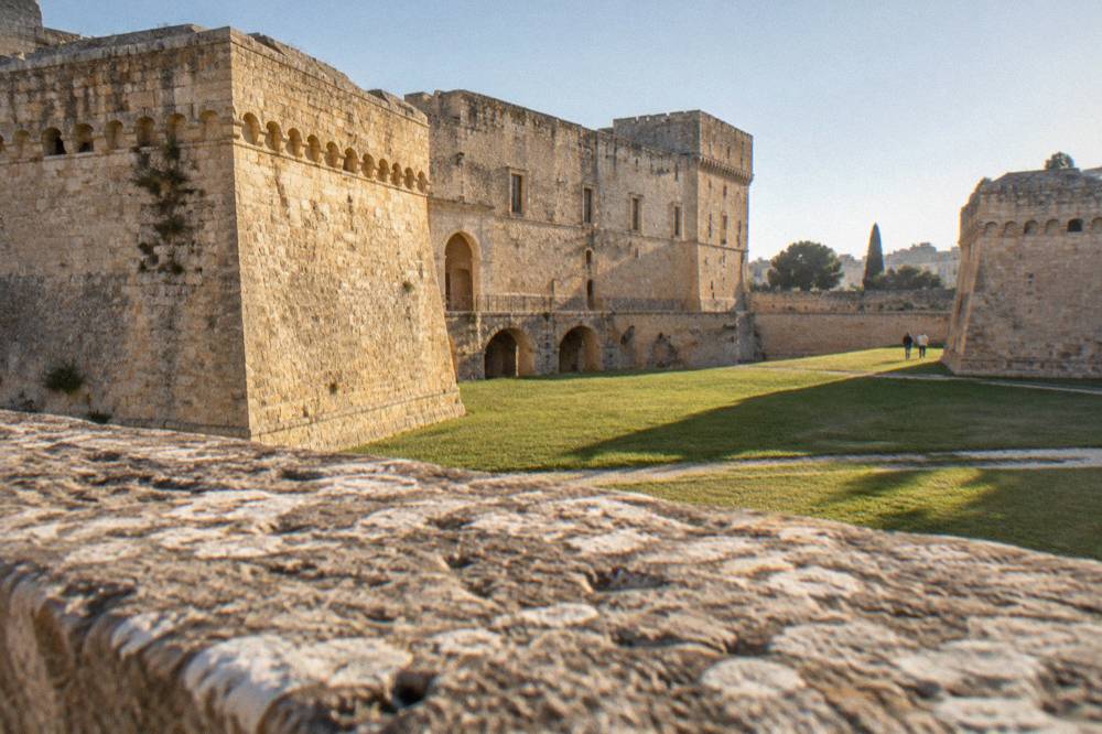 The stone courtyard and ramparts of Castello Carlo V in Lecce