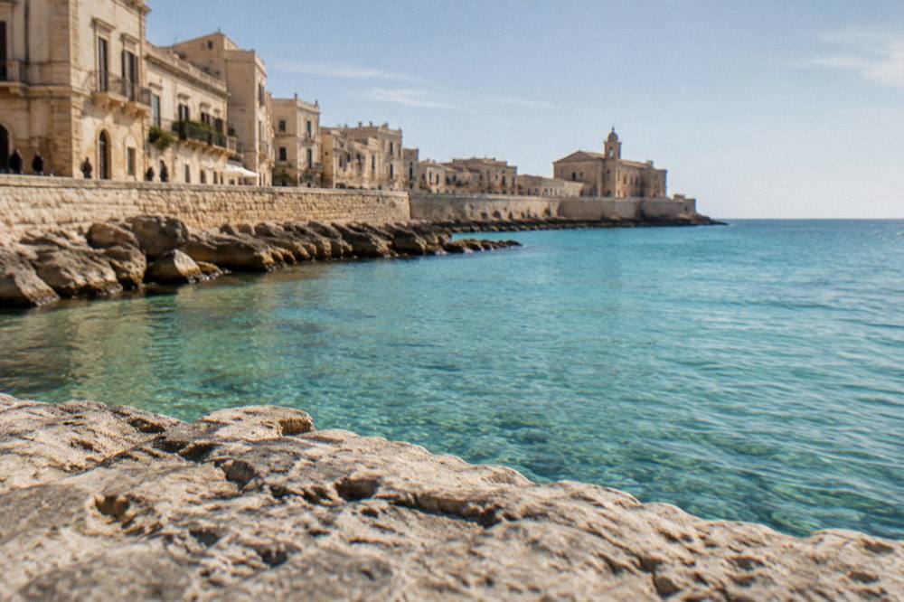 Turquoise shallow water over sand at an Ionian beach in Salento