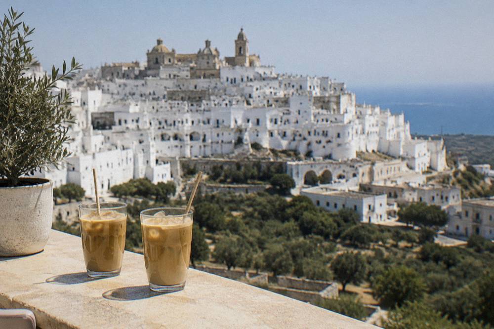 Two glasses of iced coffee with almond milk on a café counter