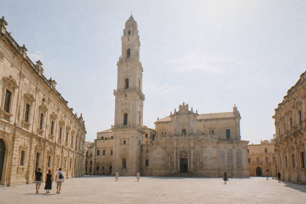 The closed square of Piazza del Duomo in Lecce with the cathedral and its tall bell tower