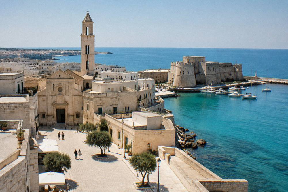 A small inland Salento piazza with pale stone houses and a church bell tower